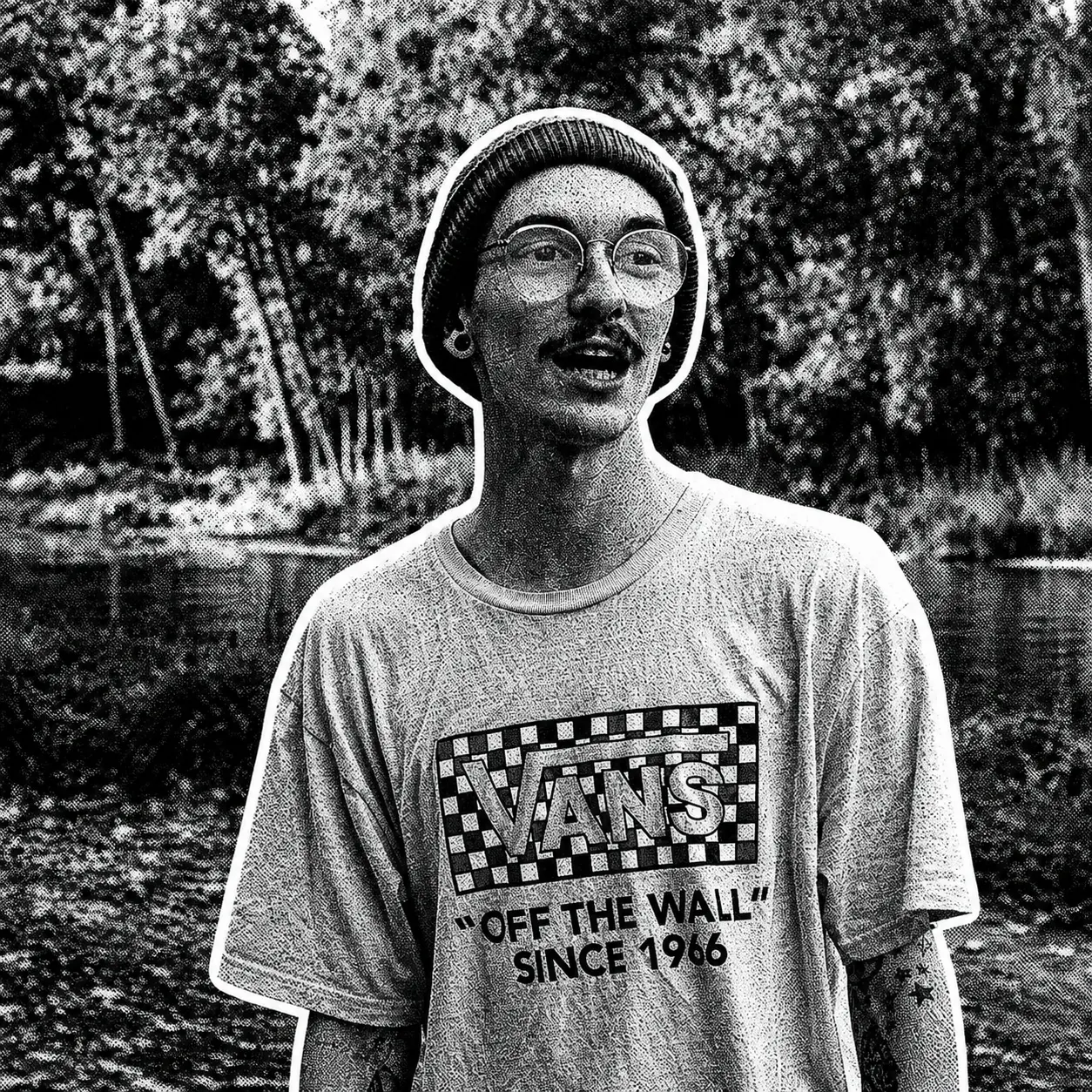 Close portrait of B4GZ wearing round glasses